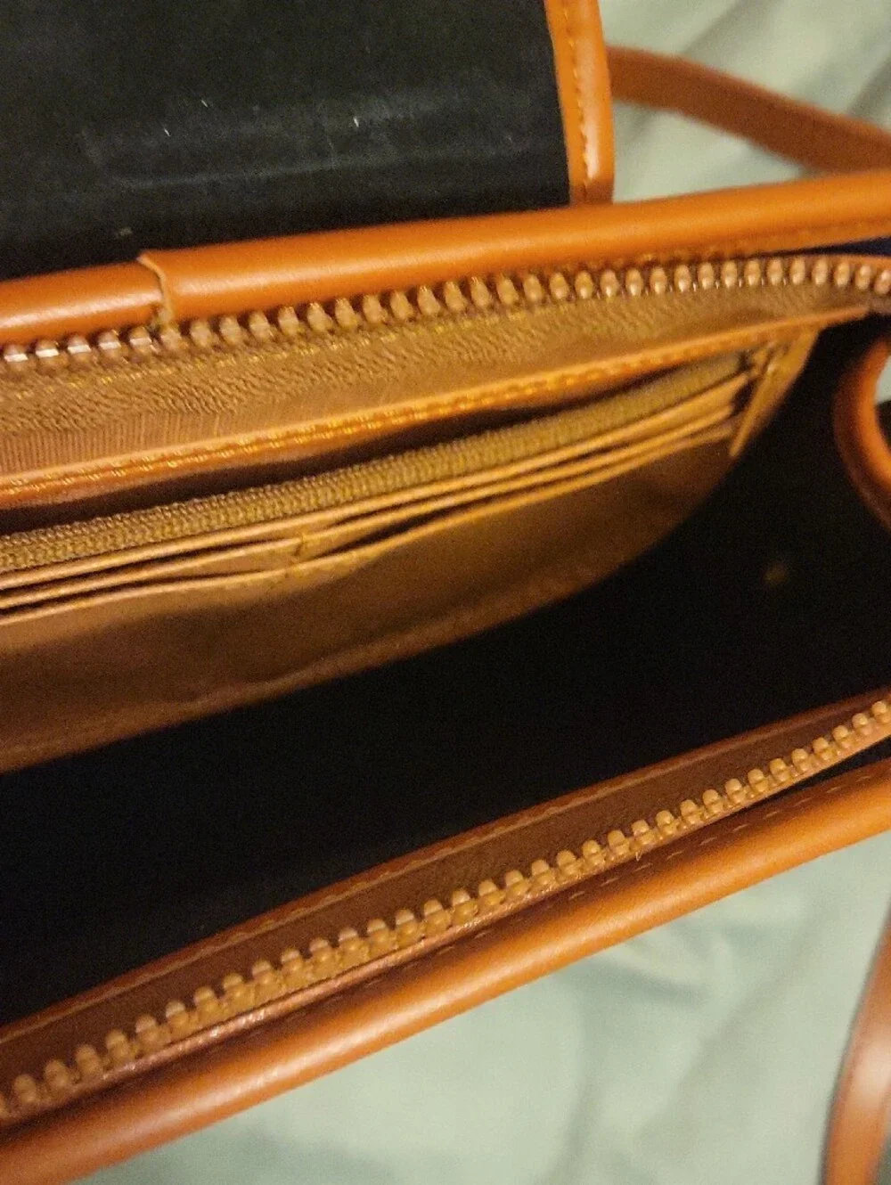 Dooney & Bourke Navy and Tan Pebbled Leather Crossbody